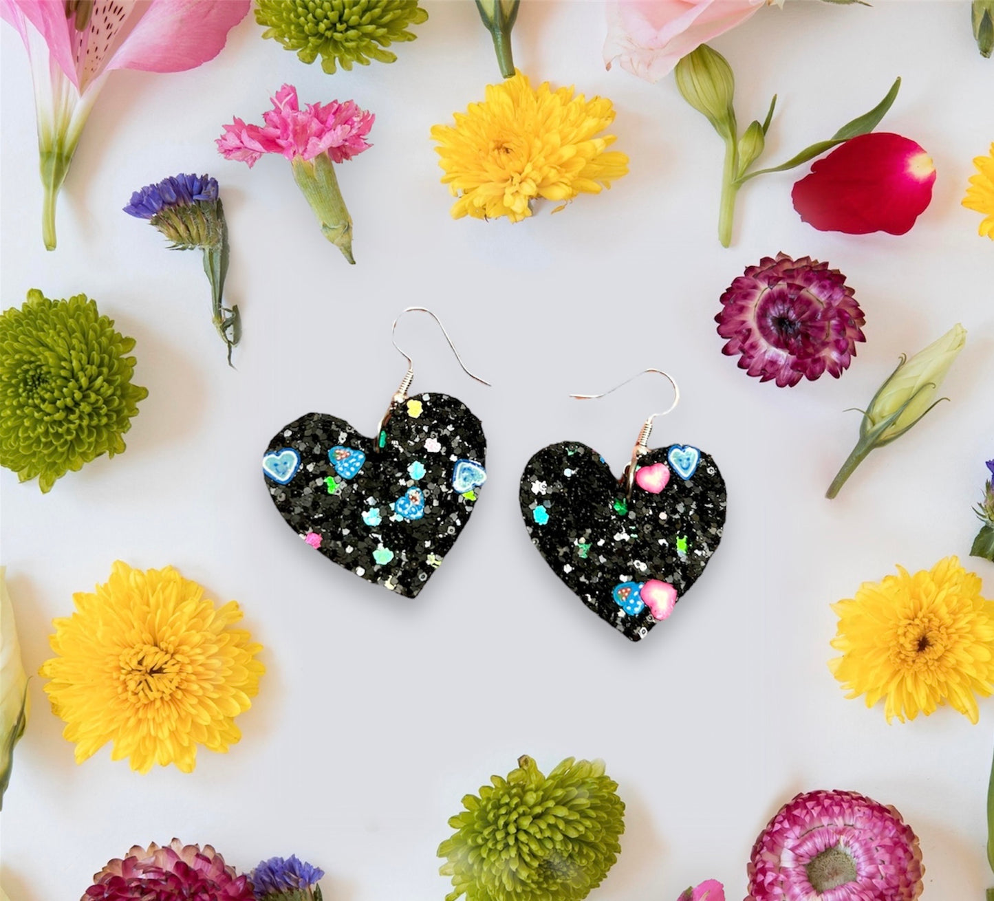 Black glitter heart leather earrings