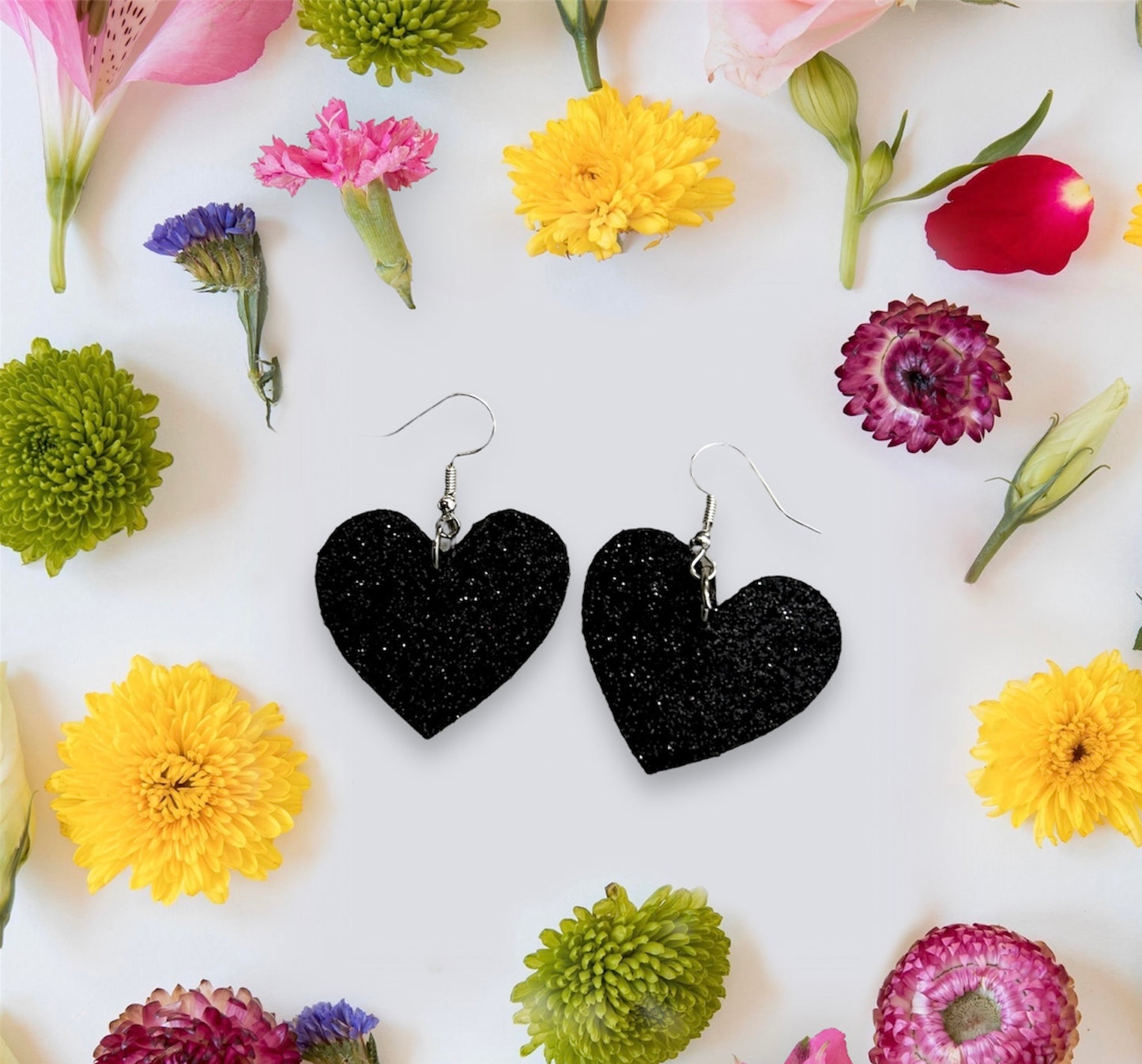 Black glitter heart leather earrings