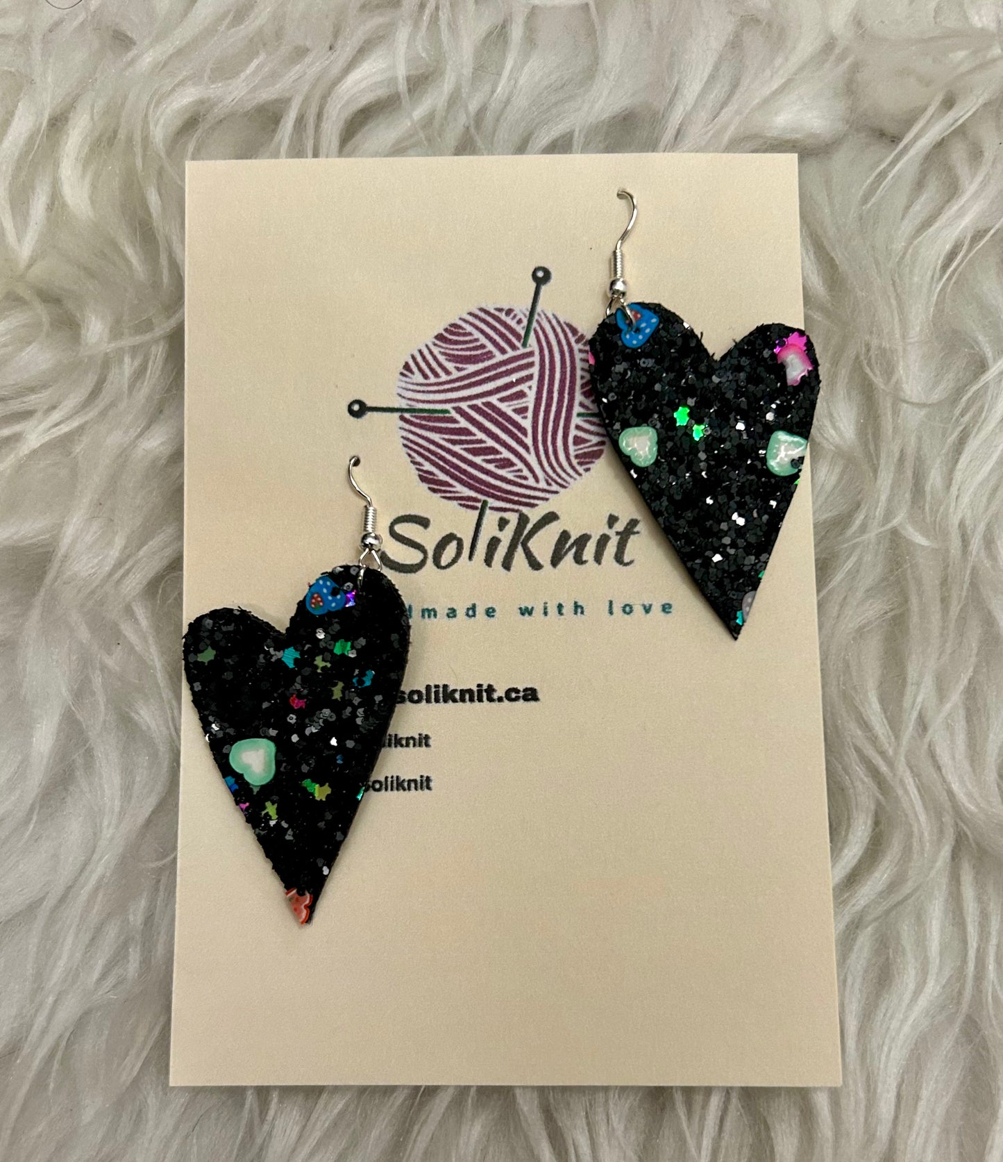 Black asymmetrical heart leather earrings