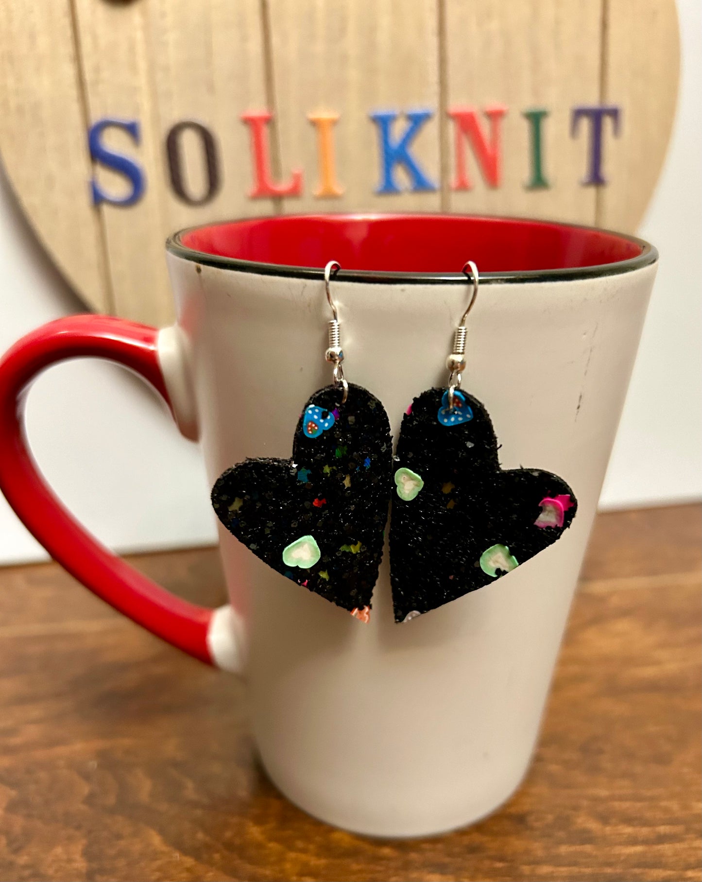 Black asymmetrical heart leather earrings