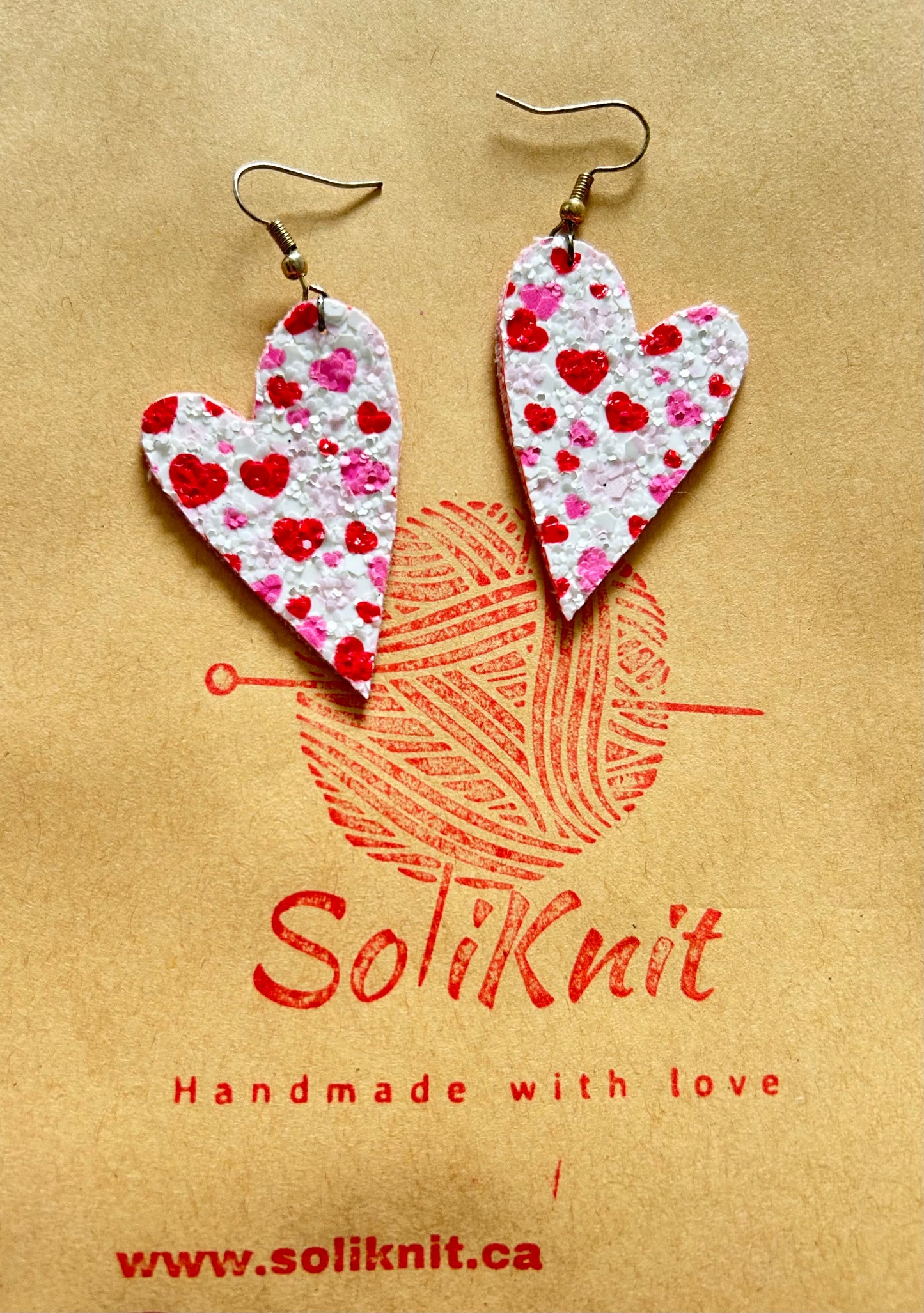 Red asymmetrical heart leather earrings