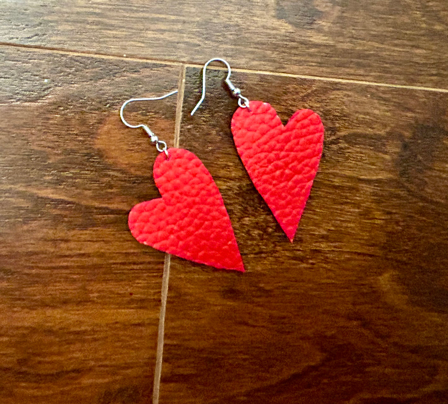 Red asymmetrical heart leather earrings