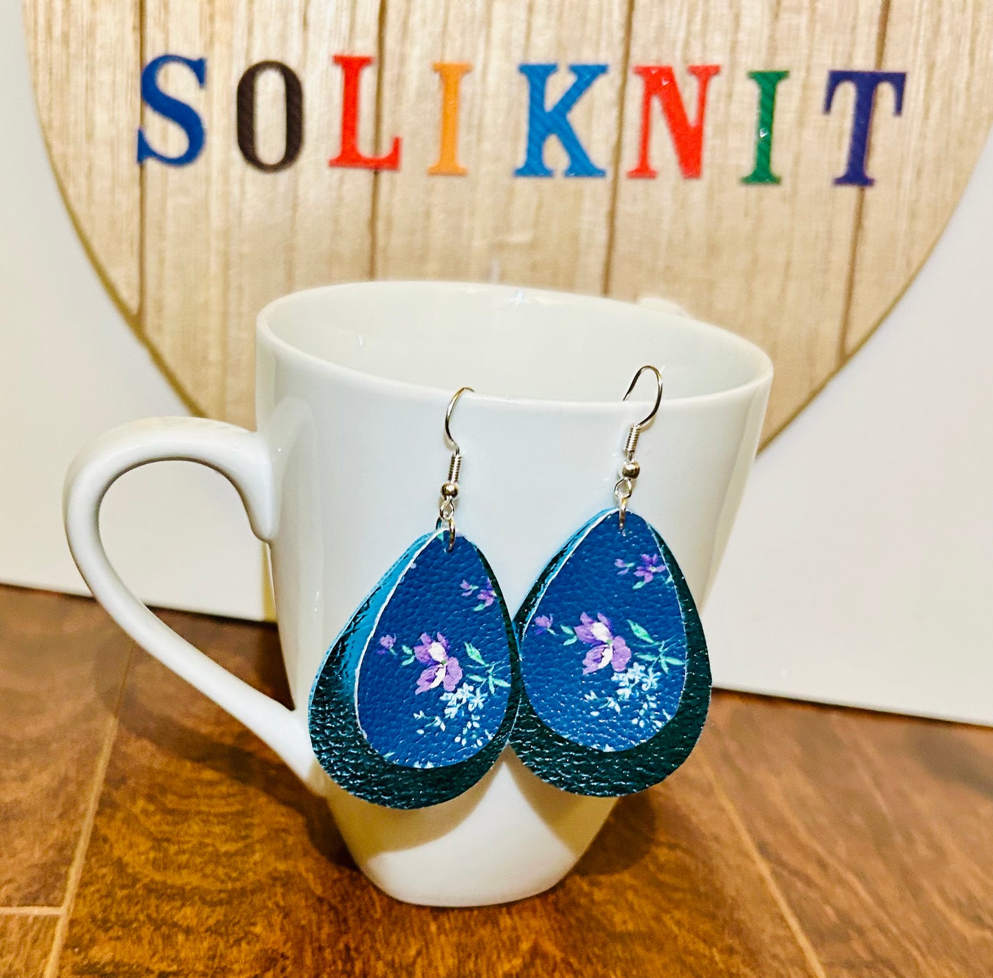 Blue and floral tear drop of double leaf leather earrings