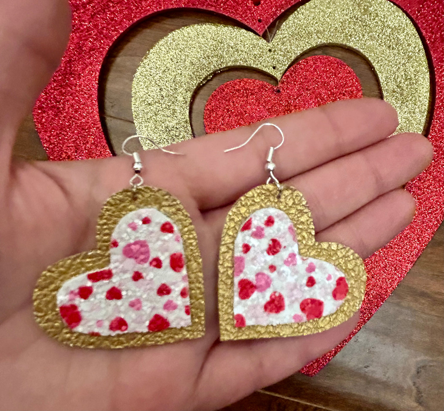 Gold-glitter heart leather earrings