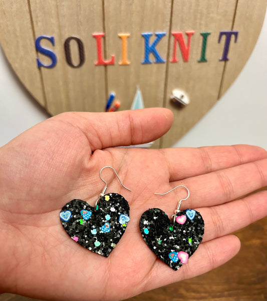 Black glitter heart leather earrings