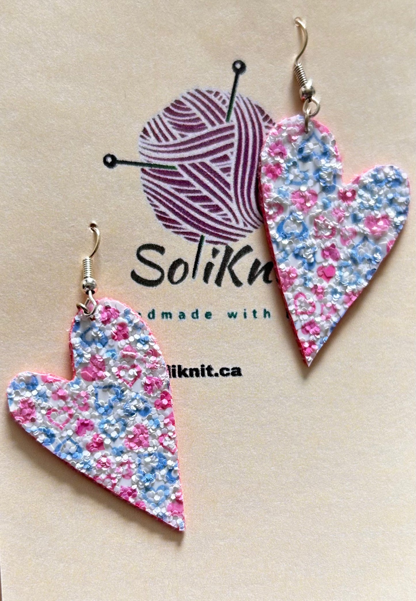 Pink asymmetrical heart leather earrings